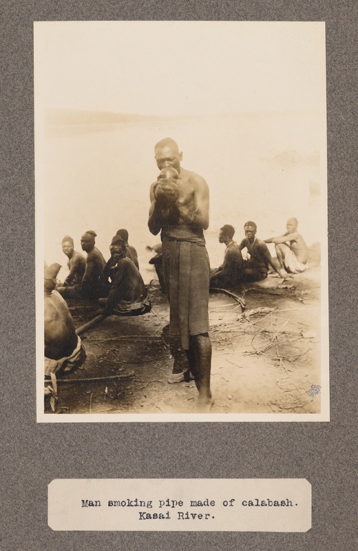 Man smoking pipe made of calabash. Kasai River