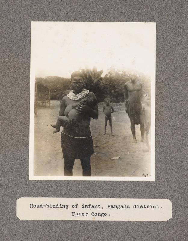 Head-binding of infant, Bangala district. Upper Congo