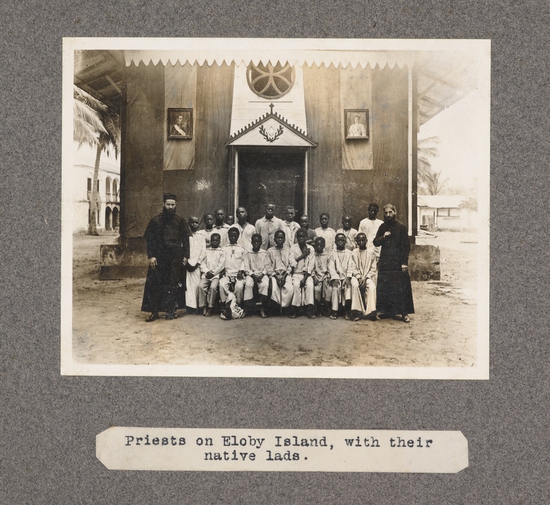 Priests on Eloby Island, with their native lads