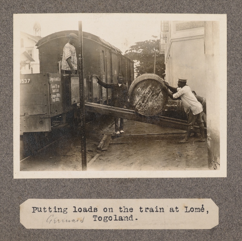 Putting loads on the train at Lomé, Togoland