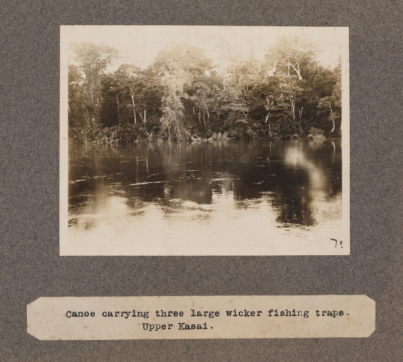 Canoe carrying three large wicker fishing traps. Upper Kasai