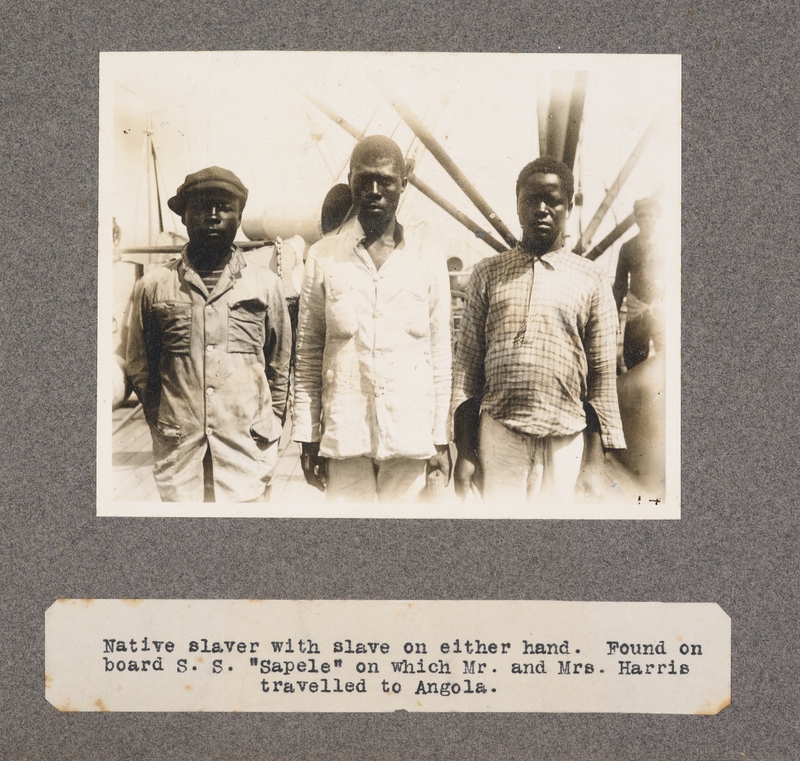 Native slaver with slave on either hand. Found on board S. S. Sapele on which Mr. and Mrs. Harris travelled to Angola