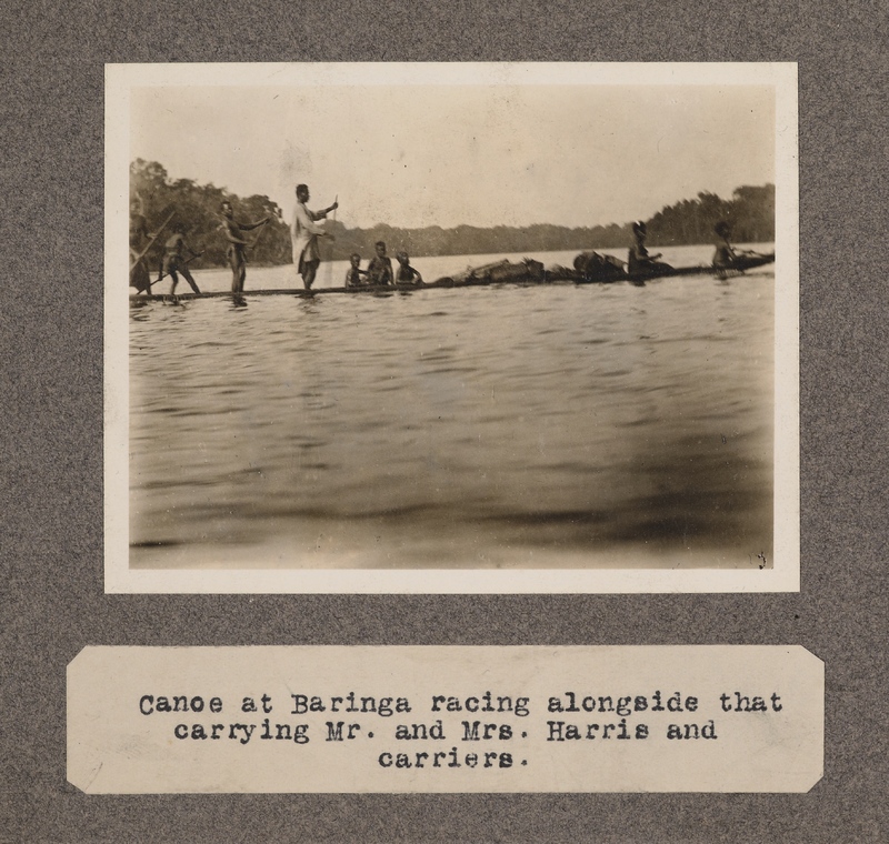 Canoe at Baringa racing alongside that carrying Mr. and Mrs. Harris and carriers