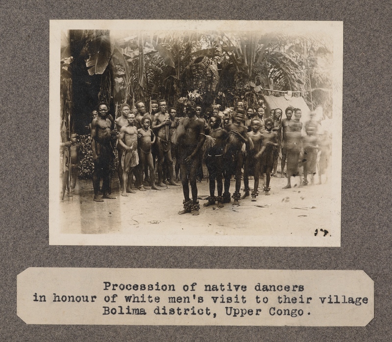 Procession of native dancers in honour of white men's visit to their village, Bolima Districts, upper Congo