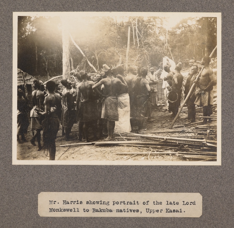 Mr. Harris showing portrait of the late Lord Monkswell to Bakuba natives, upper Kasai