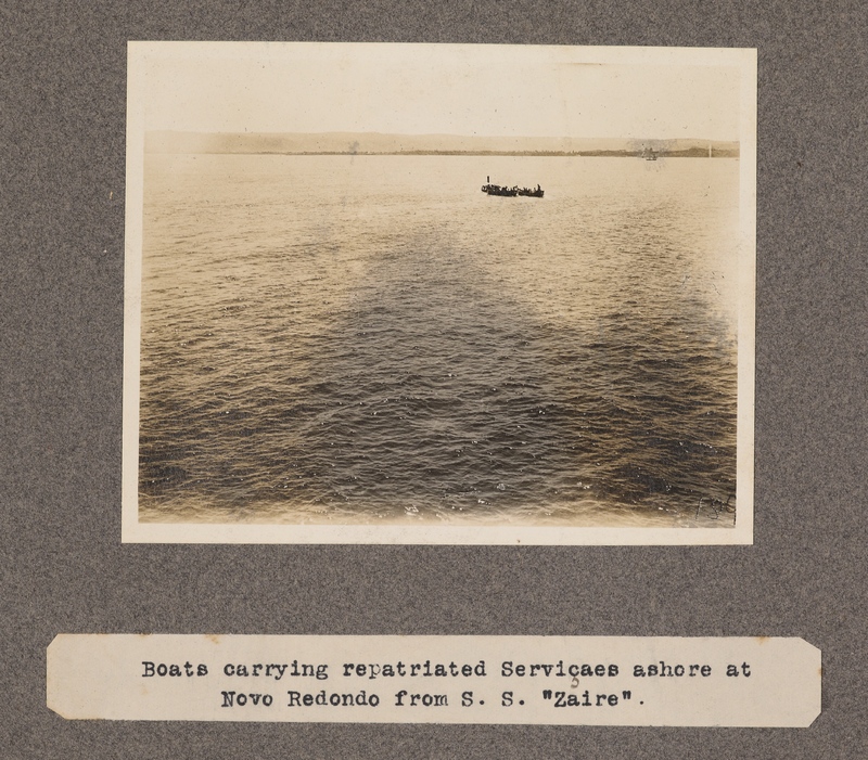 Boats carrying repatriated "servicaes" ashore at Novo Redondo from S. S. Zaire