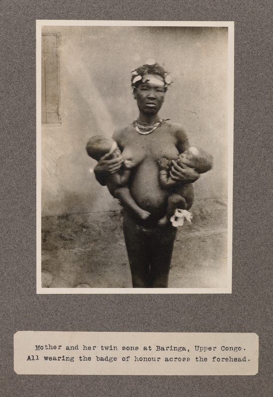 Mother and her twin sons at Baringa, upper Congo. All wearing the badge of honour across the forehead