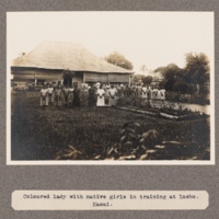 Coloured lady with native girls in training at Luebo, Kasai