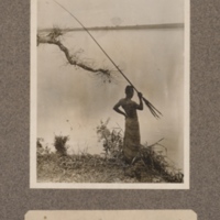 Native spearing fish on Kasai River