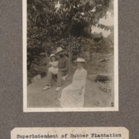 Superintendent of rubber plantation and farm at Banganju, Aruwimi, with wife and child