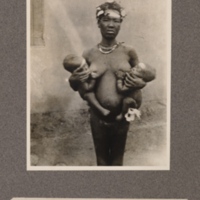 Mother and her twin sons at Baringa, upper Congo. All wearing the badge of honour across the forehead