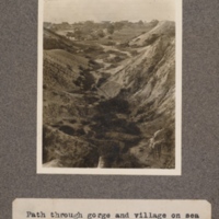 Path through gorge and village on sea shore, St. Paul de Loanda